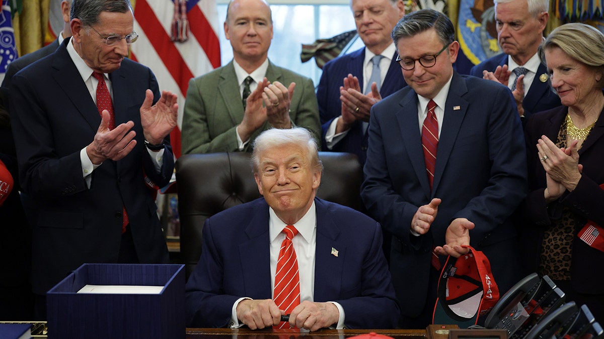 Trump smiles in Oval Office of White House