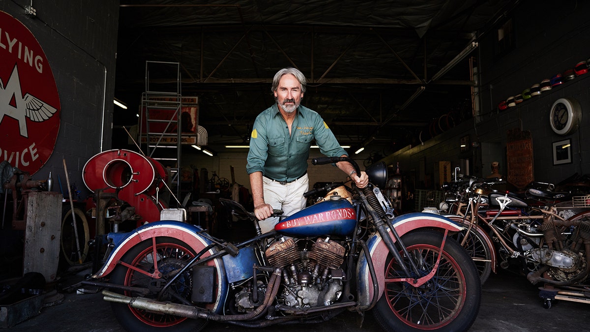 Mike Wolfe showing off his motorcycle on "History's Greatest Picks."
