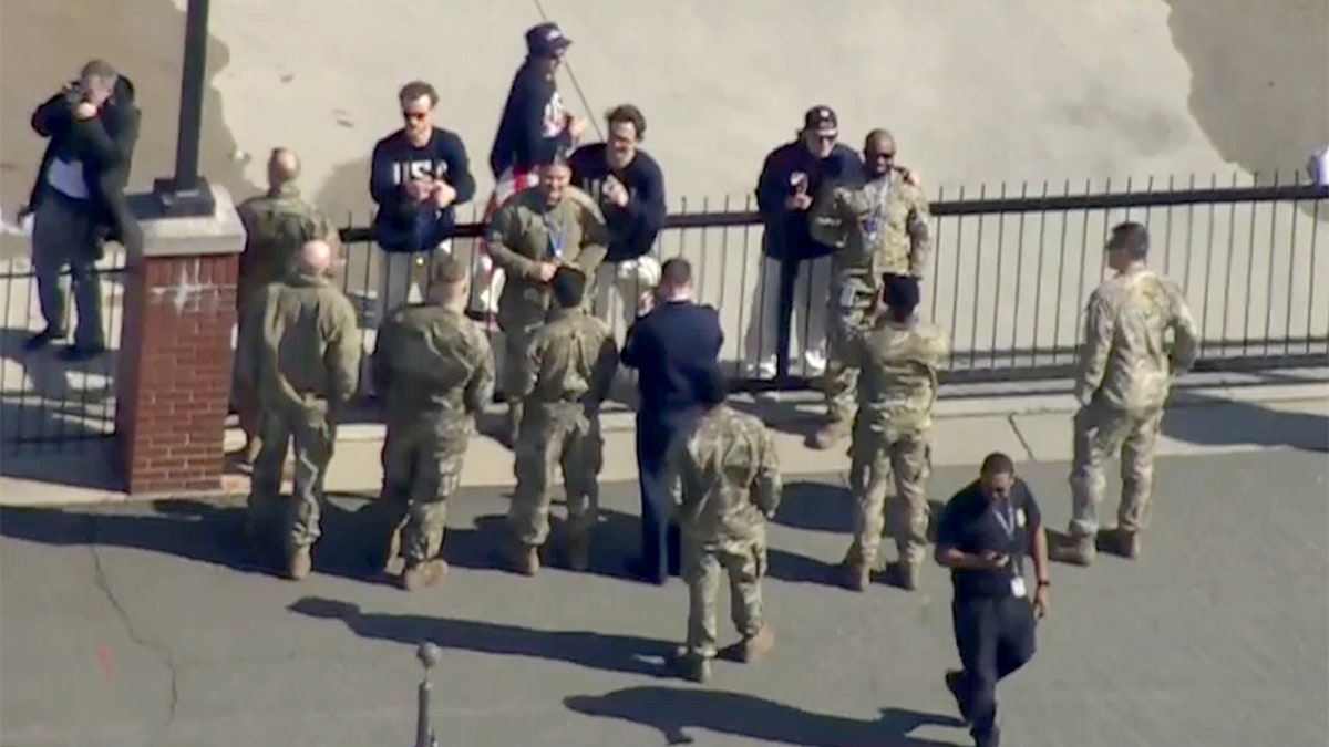 Military members wear gold medals