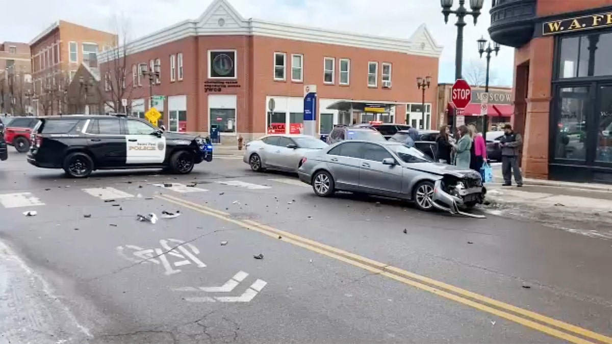 Police cars and vehicle after a crash.