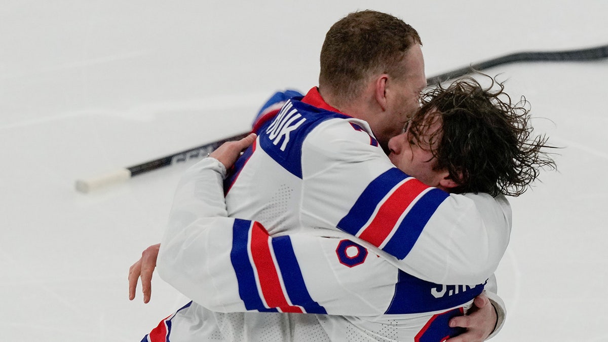 Brady Tkachuk hugs Jack Hughes