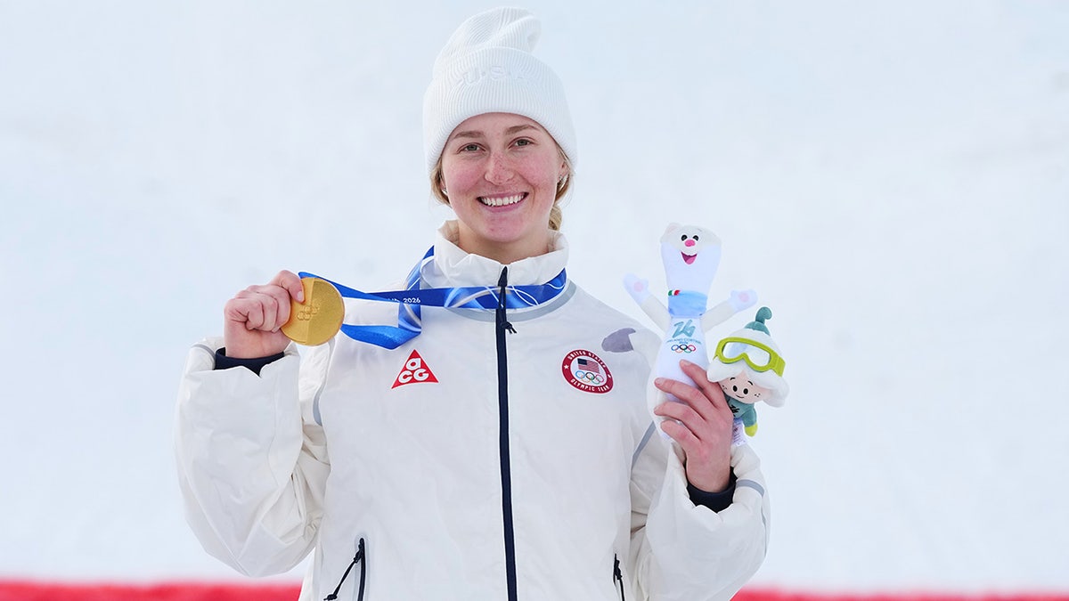 Elizabeth Lemley holds the gold medal
