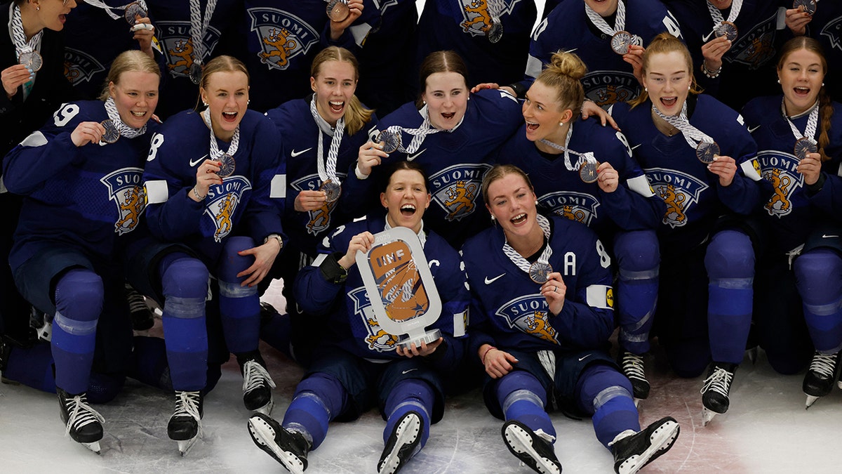 Finland players celebrate a bronze medal