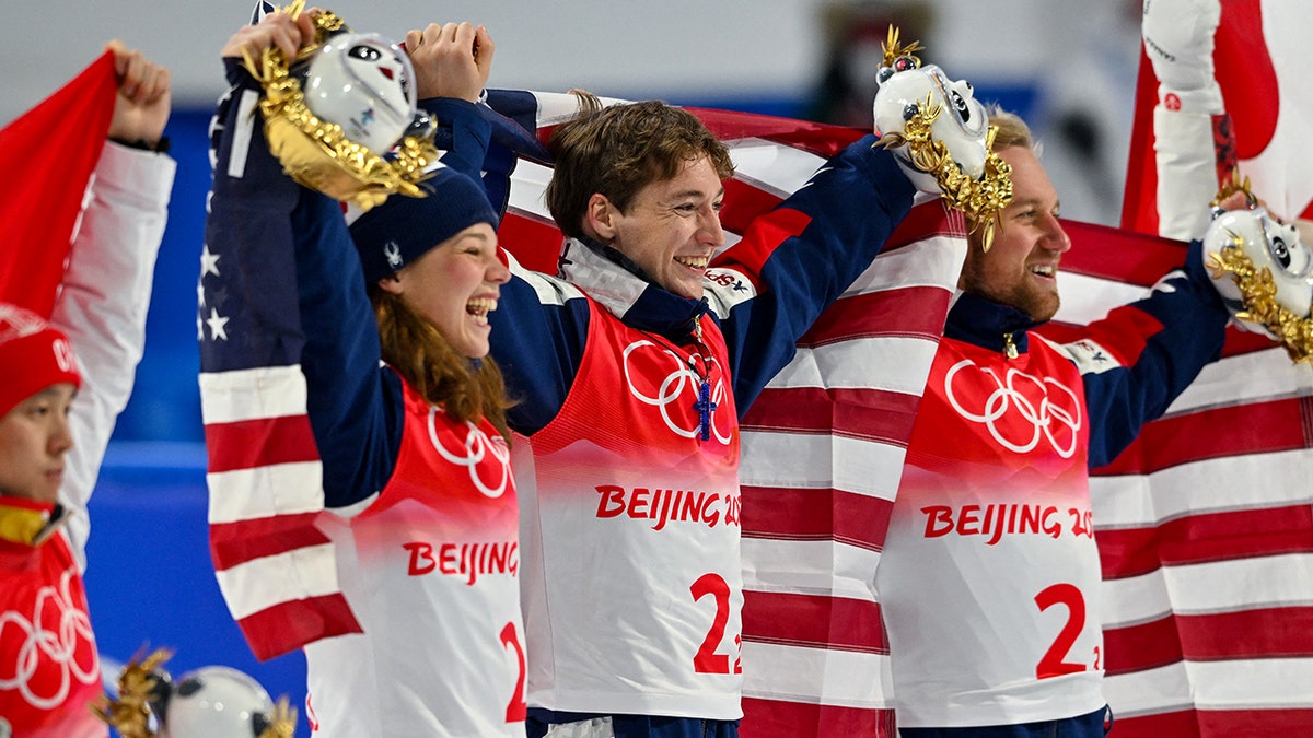 Christopher Lillis poses with an American flag
