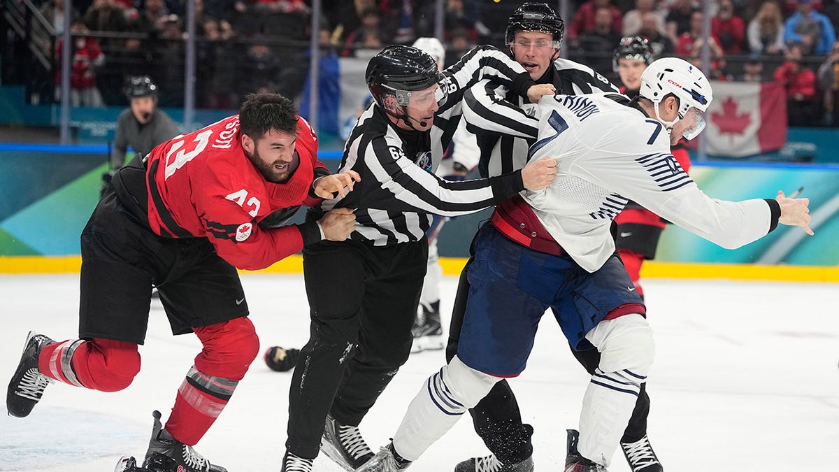 Refs try to break up the fight