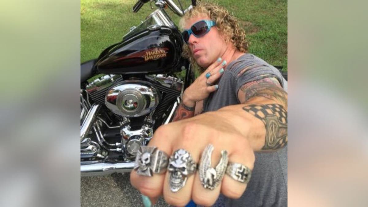 Robert Dorgan posing next to a motorcycle in an undated photo related to the Rhode Island ice rink shooting.