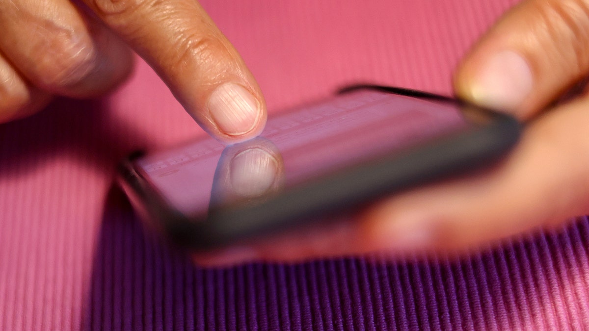 Woman typing on her smartphone.