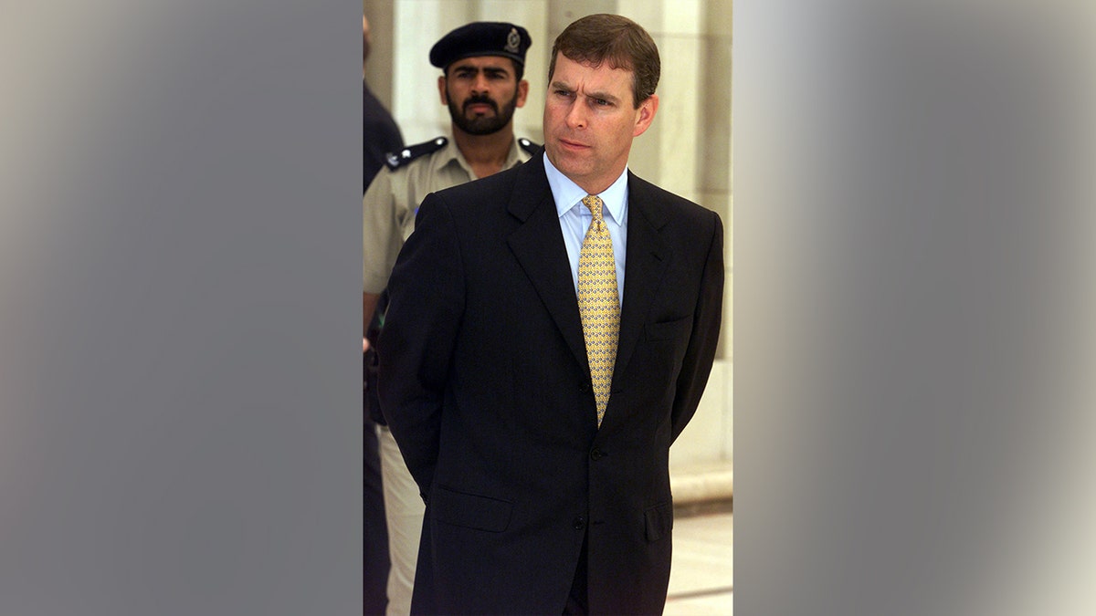 Prince Andrew while visiting a mosque in Oman in 2001