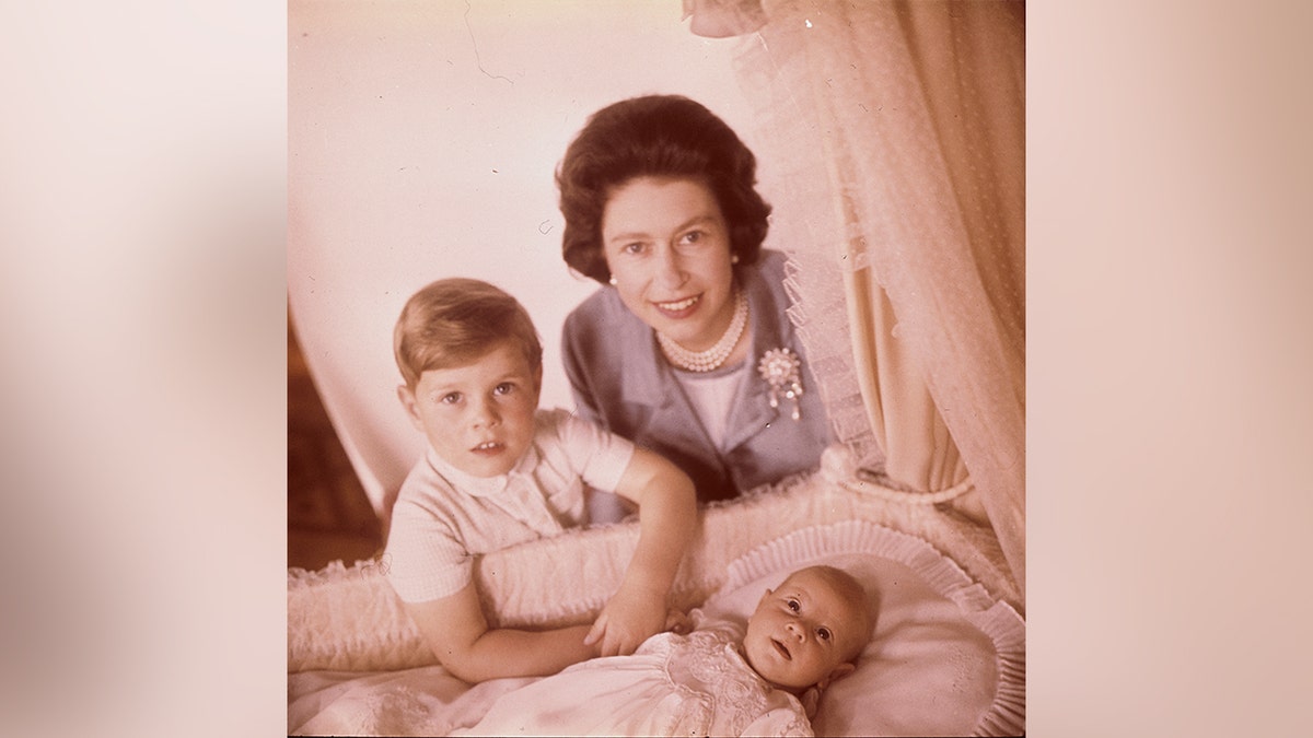 Prince Andrew with Queen Elizabeth and his baby brother, Prince Edward in 1964.