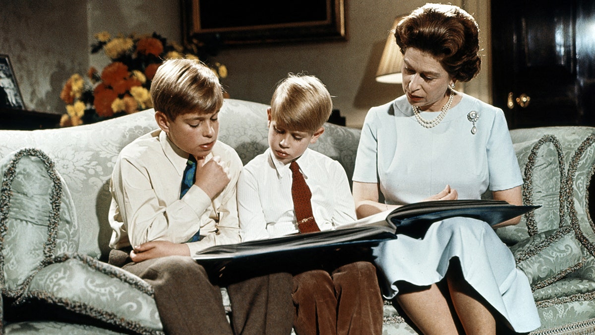 Prince Andrew, Prince Edward and Queen Elizabeth reading during her Christmas address in 1971.