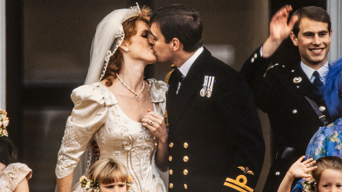 Andrew and Sarah Ferguson share a kiss on the Buckingham Palace balcony on their wedding day in 1986.