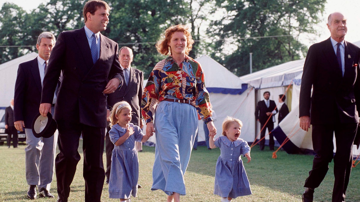 Prince Andrew and Sarah Ferguson with their daughters touring the grounds of the Royal Windsor House Show in 1992.