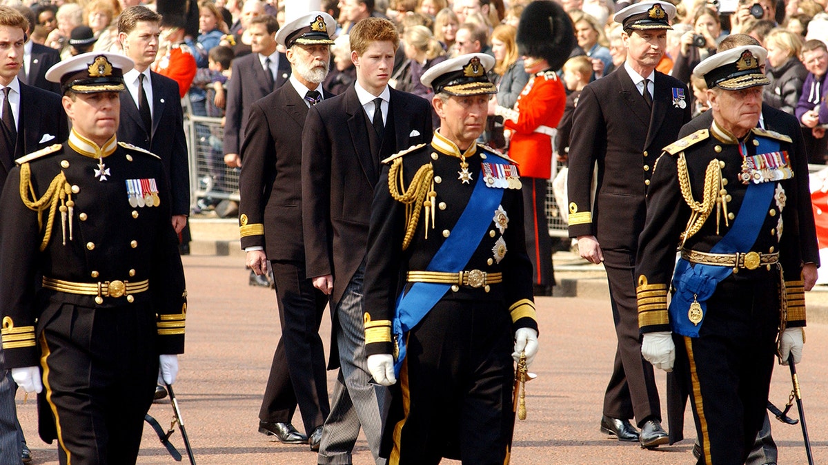 Prince Andrew, Prince Charles and Prince Philip leading the charge at the Queen Mother's funeral in 2002.