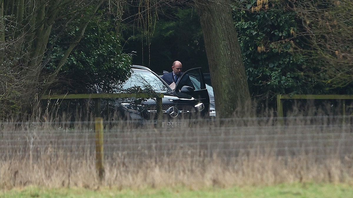A man stepping out of an unmarked car at the home of Andrew Mountbatten-Windsor in Sandringham, Norfolk.