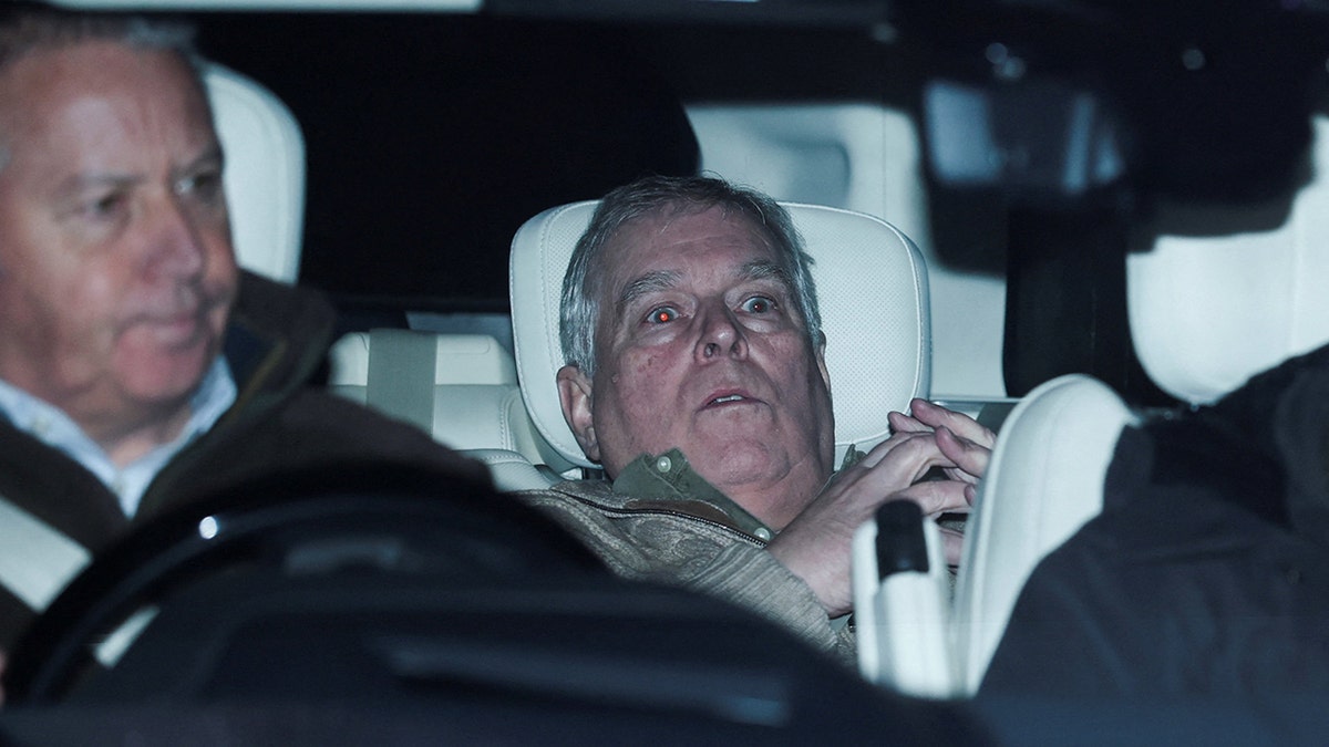Andrew Mountbatten-Windsor seated in a vehicle while departing Aylsham Police Station.