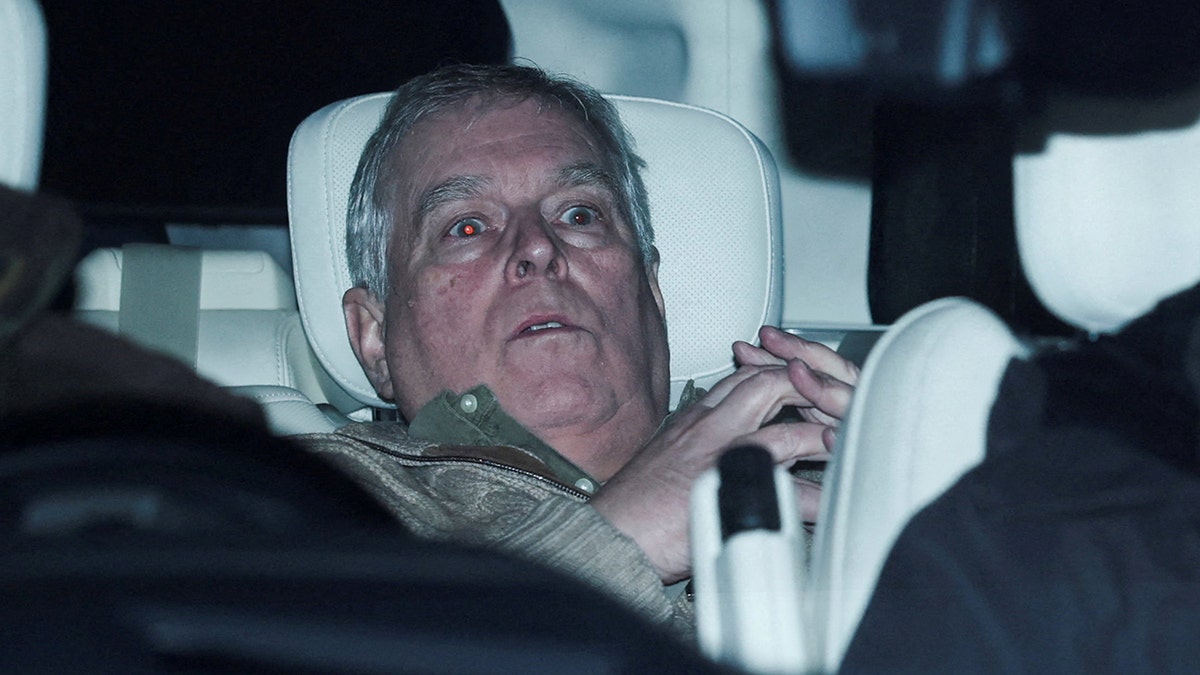 Andrew Mountbatten-Windsor seated in a vehicle while departing Aylsham Police Station.