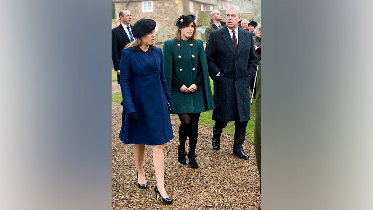 Princess Eugenie, Princess Beatrice, and Prince Andrew walking toward St Lawrence Church.