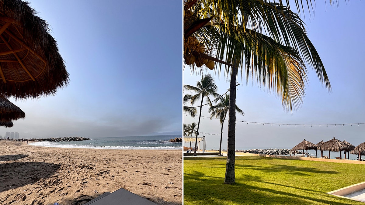 view from a beach of smoke rising above Puerto Vallarta, Mexico