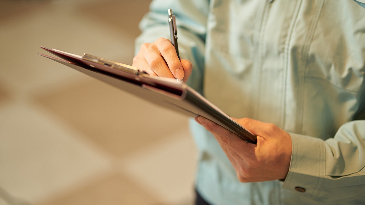Health inspector in restaurant.