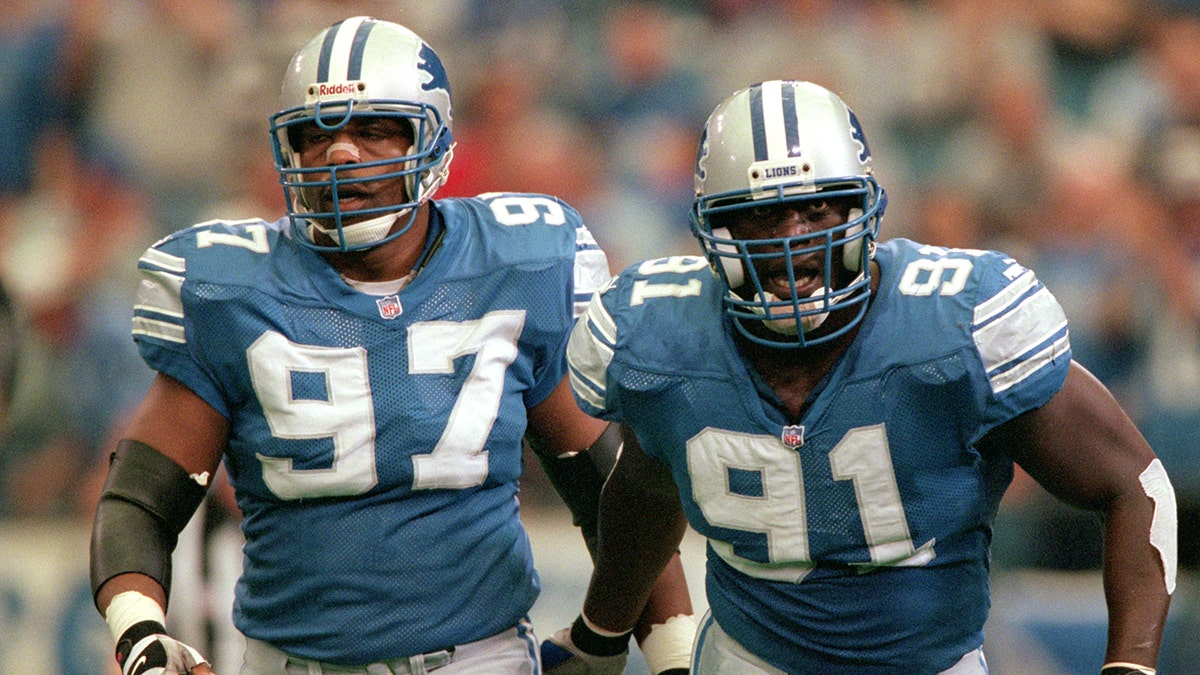 Tracy Scroggins walks off the football field