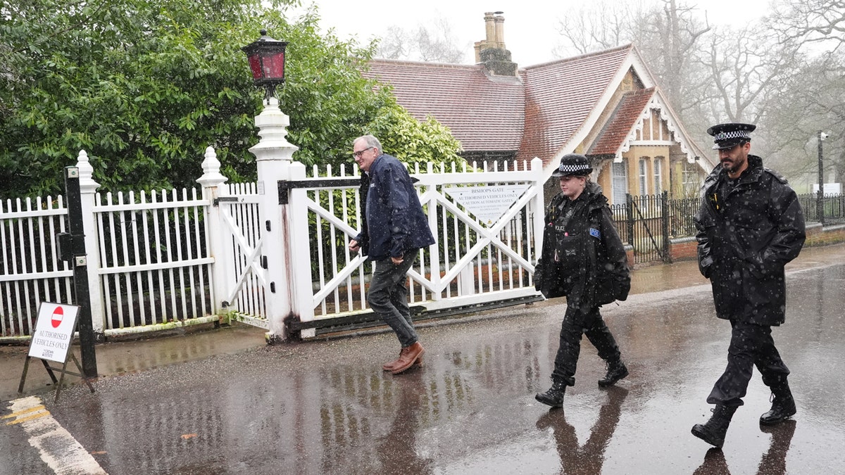 Police officers standing outside Royal Lodge in Windsor, Berkshire.