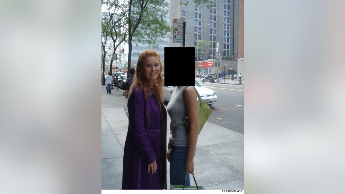 Sarah Ferguson standing outside posing with an unidentified woman.