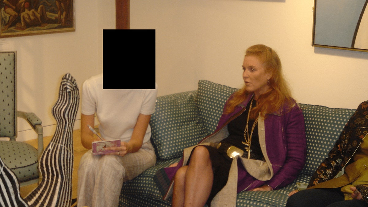 Sarah Ferguson sitting down with an unidentified woman.