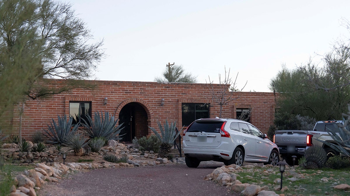 The beforehand   exterior of Nancy Guthrie's location   including the entryway and surrounding landscaping.