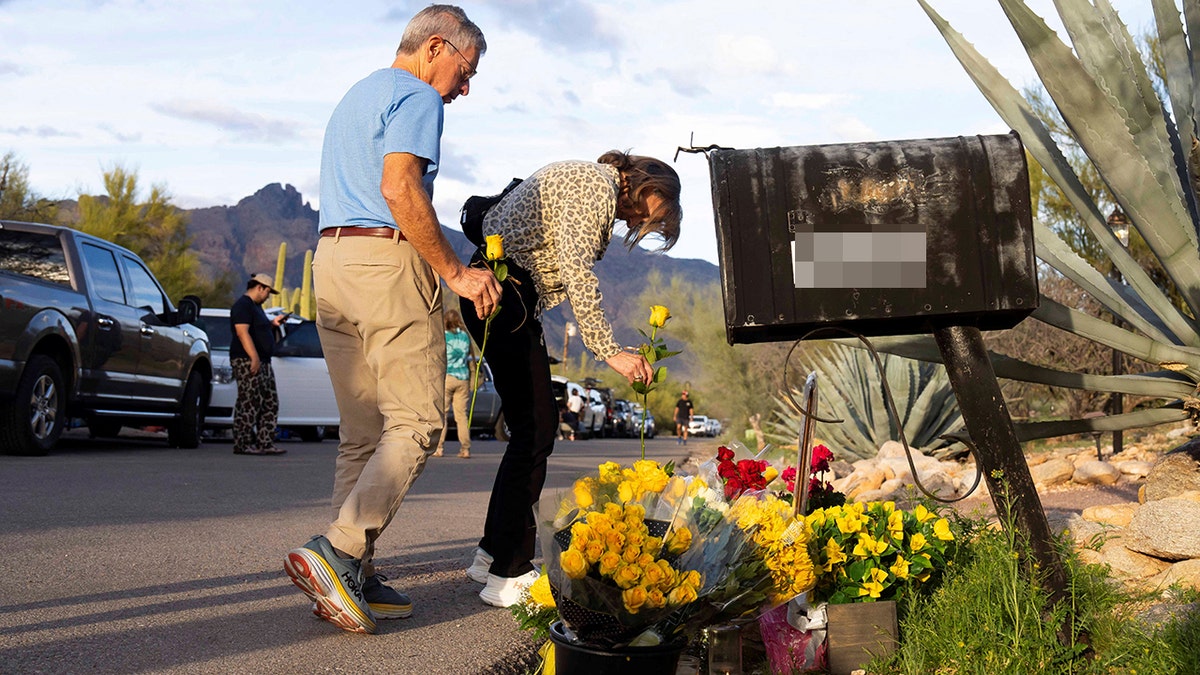 Well-wishers placing flowers outside Nancy Guthrie's home in Tucson