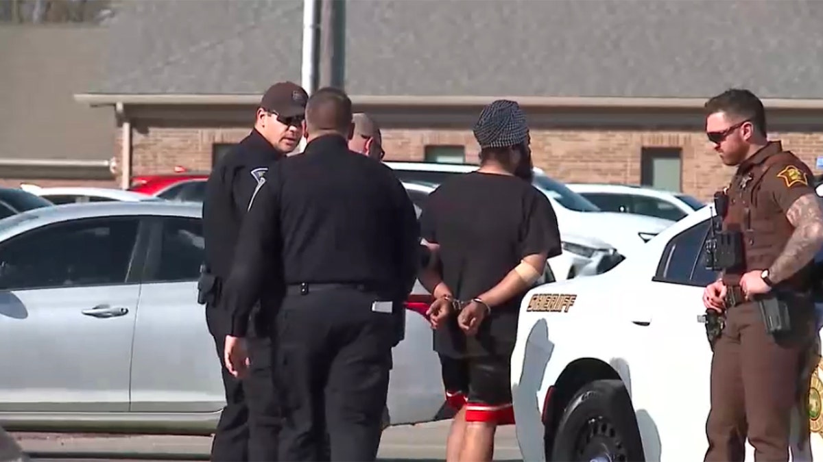 Singh Sukhdeep in handcuffs