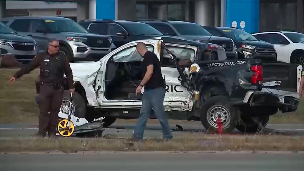 Totaled Chevrolet truck on road after crash