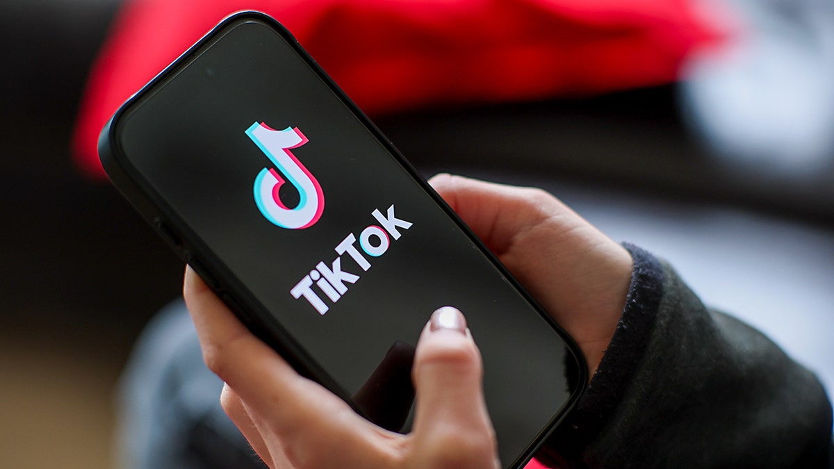 Woman typing on the phone.