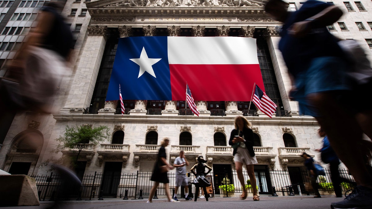 A photo of the New York Stock Exchange with the Texas flag.