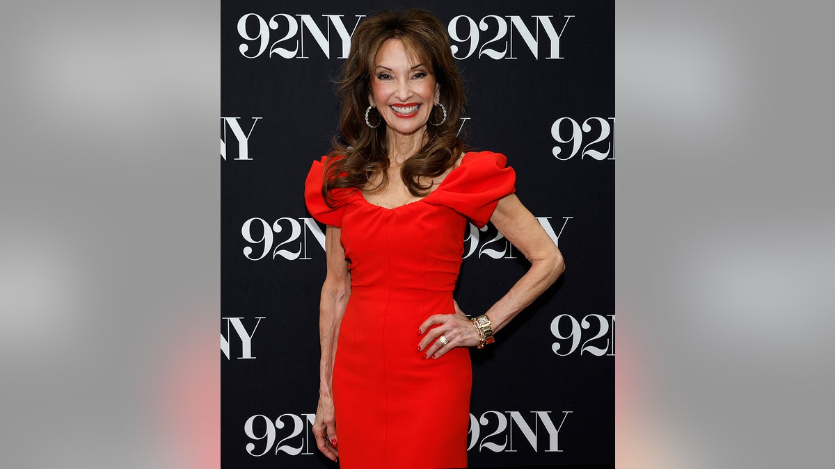 Susan Lucci in a red dress posing at 92NY.