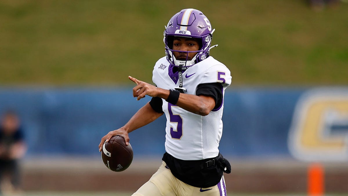 Taron Dickens runs on field