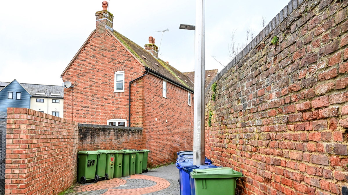 Cotswolds town with trash cans