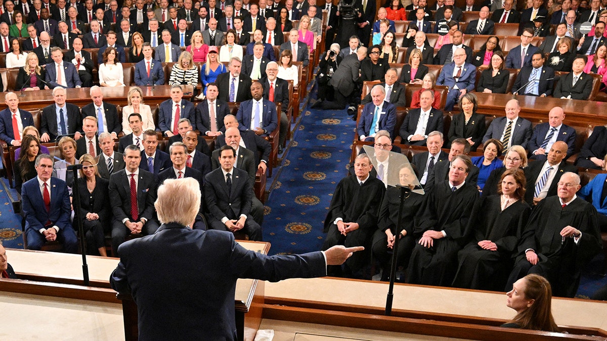 President Donald Trump gestures while speaking to joint session of Congress
