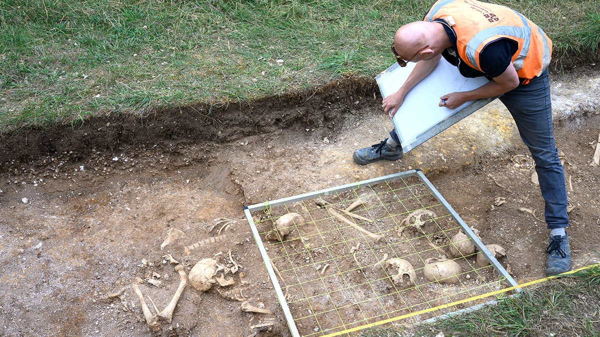 Archaeologist sifting ungraded  astatine  burial