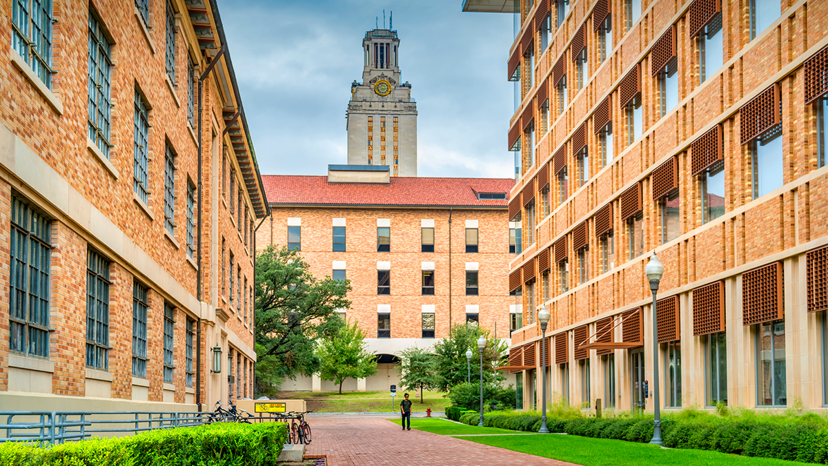 Student walks on the University of Texas campus