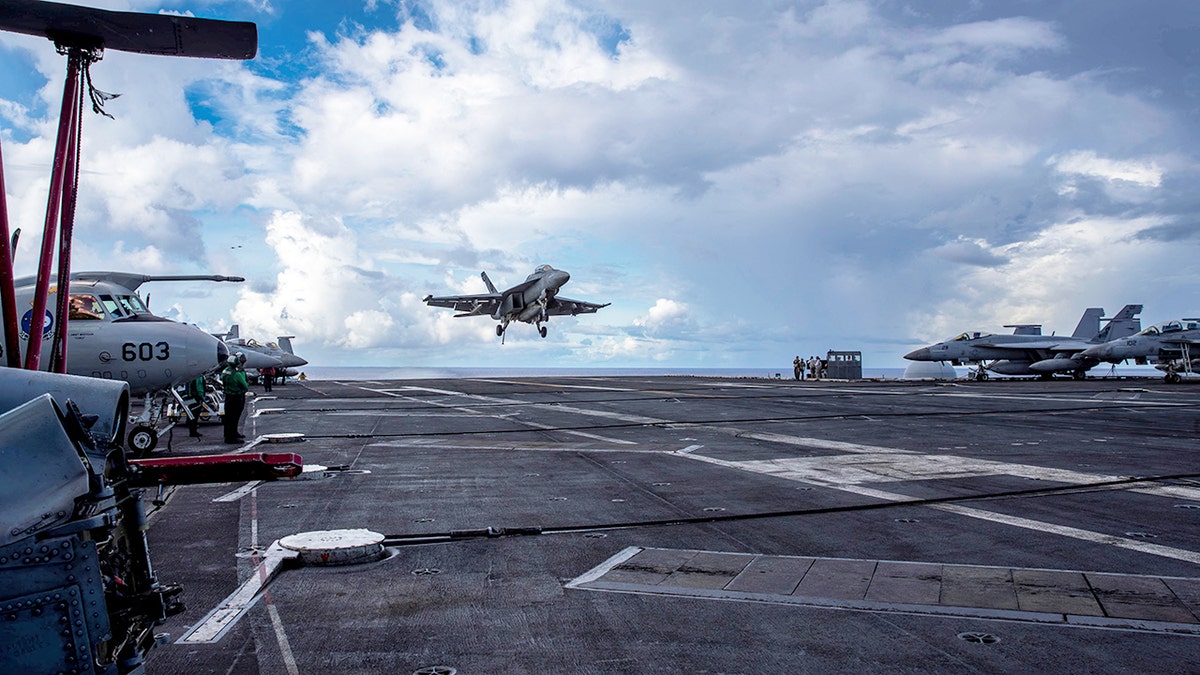 F/A-18F Super Hornet lands on the flight deck of the USS Abraham Lincoln