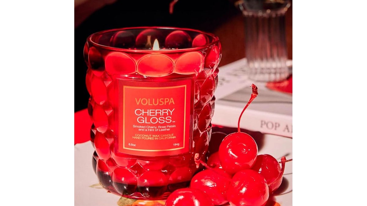 This candle sets the mood with a romantic warm glow.