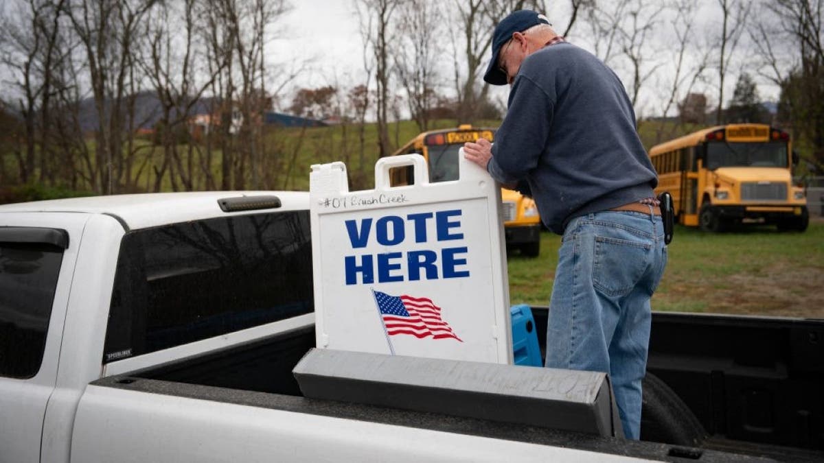 Election supplies are loaded into a voting tent set up the day before the US presidential election, on November 4, 2024 in Burnsville, North Carolina.
