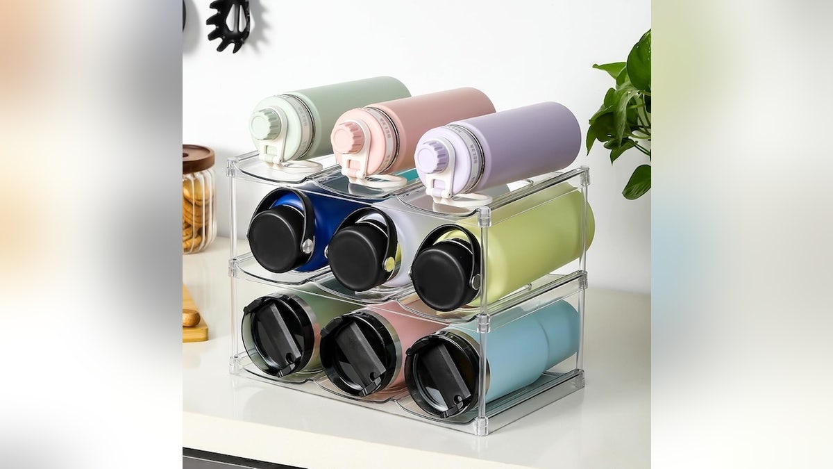 This water bottle organizer shelf makes better use of your cabinet space.