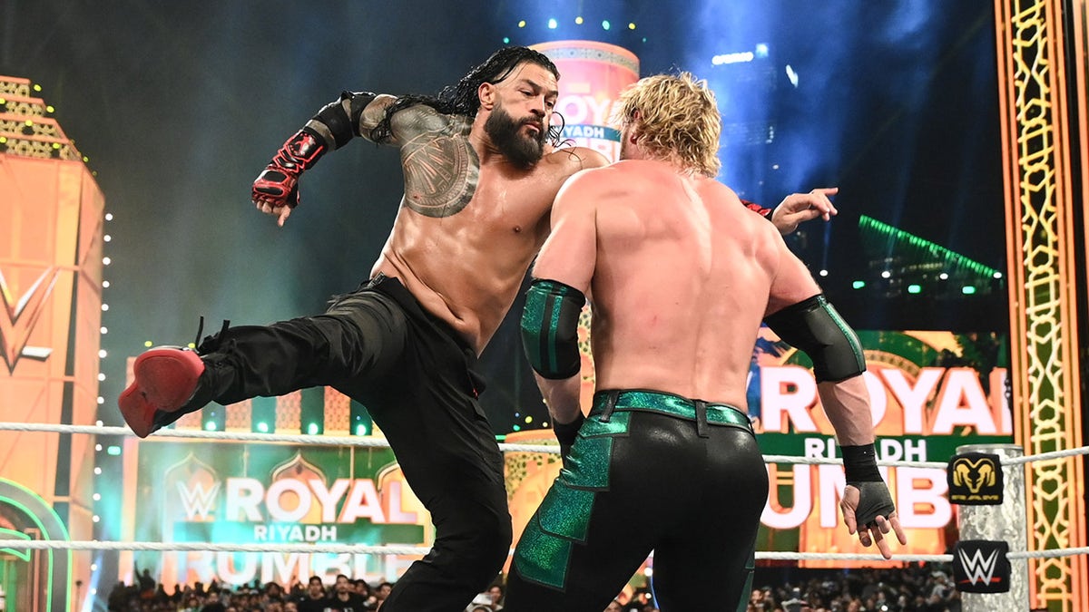 Roman Reigns knocks Logan Paul