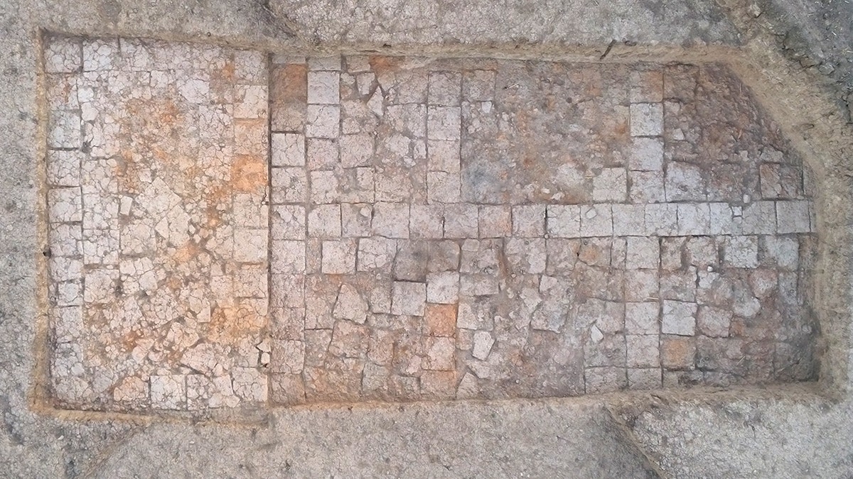 Aerial view of cross on excavation floor