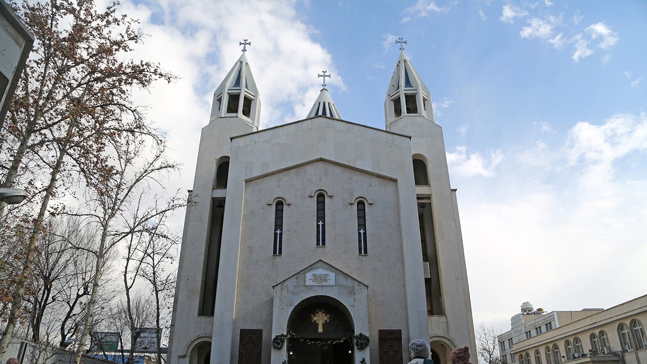 Iranian Christian church congregation gathering under threat of persecution from the Islamic regime