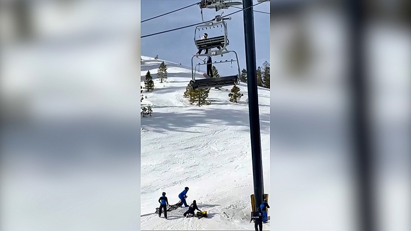 Image: Ski resort staff position a safety net beneath a chairlift where a child dangled above the snow at Mammoth Mountain in California on Jan. 31, 2026.