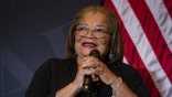 Dr. Alveda King speaking into microphone