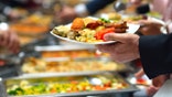 Man holding buffet plate