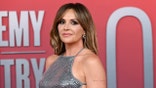 Carly Pearce posing on the red carpet at the Academy of Country Music Awards.